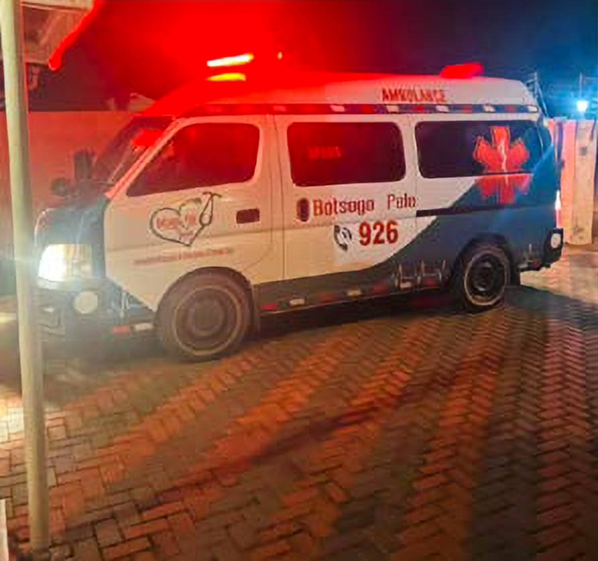Botsogo Pele ambulance with emergency lights on at night