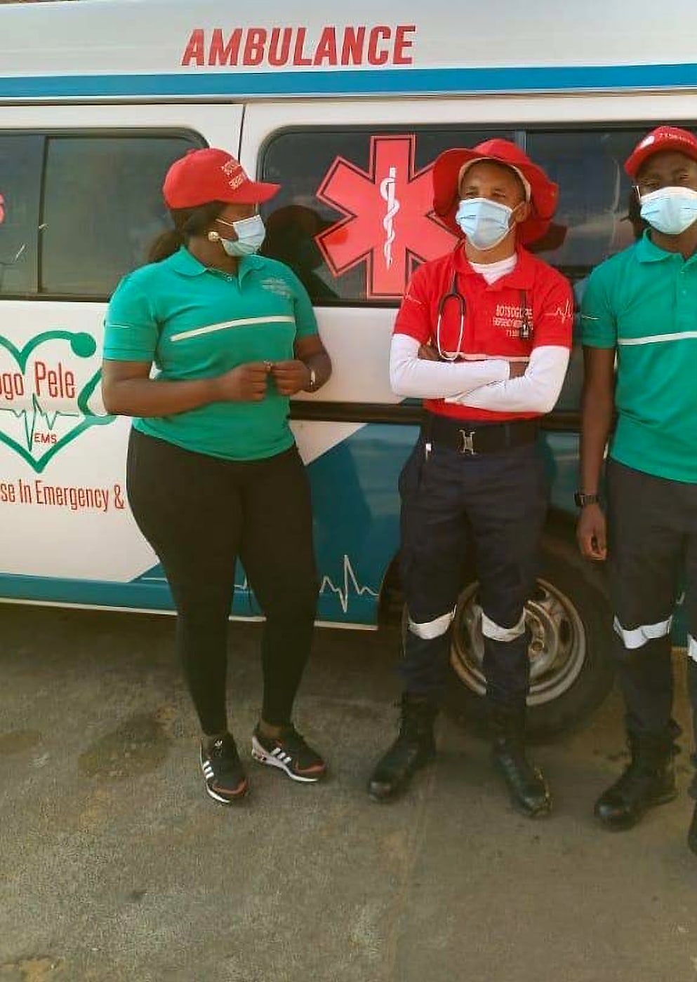 Botsogo Pele EMS crew standing beside their ambulance
